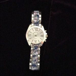 Gold watch with roses decorations on bracelet